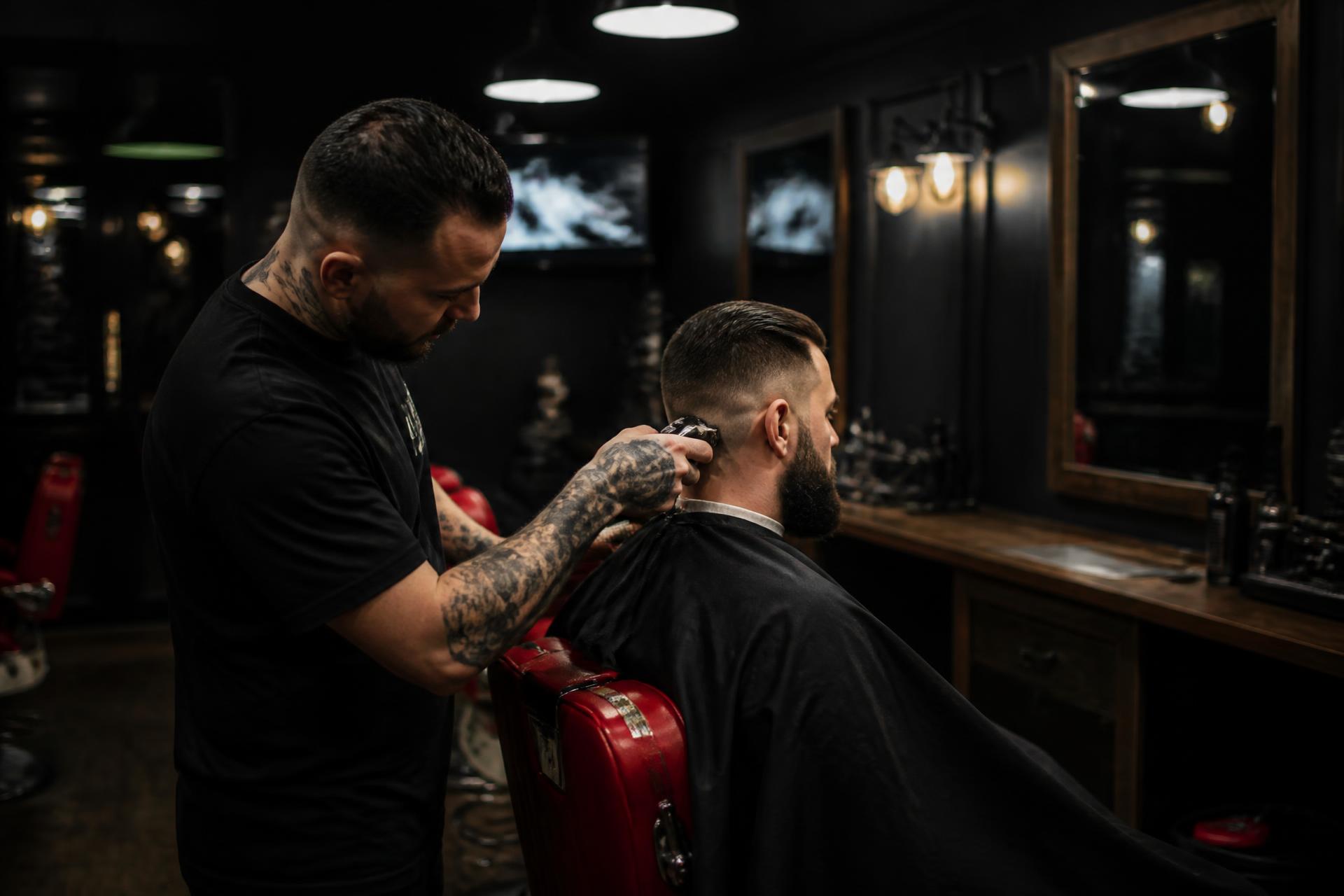 Barber finishing a precise fade inside the BarberStarz shop in Fresno